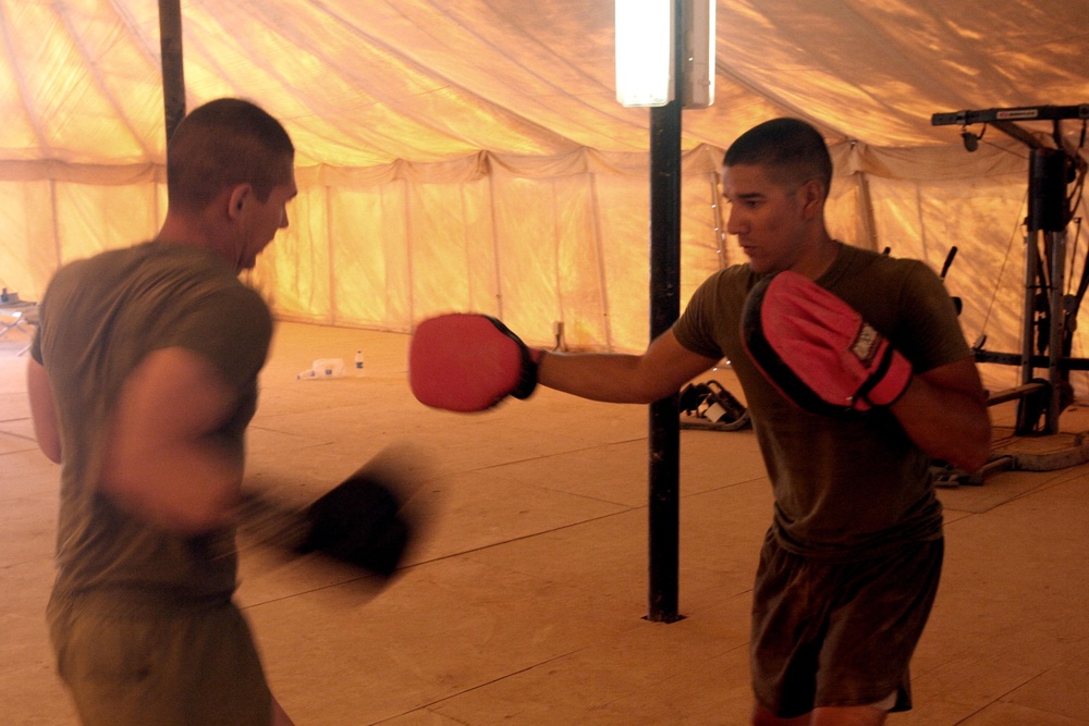 Boxing sailor mixes it up with Marines, colleagues during training