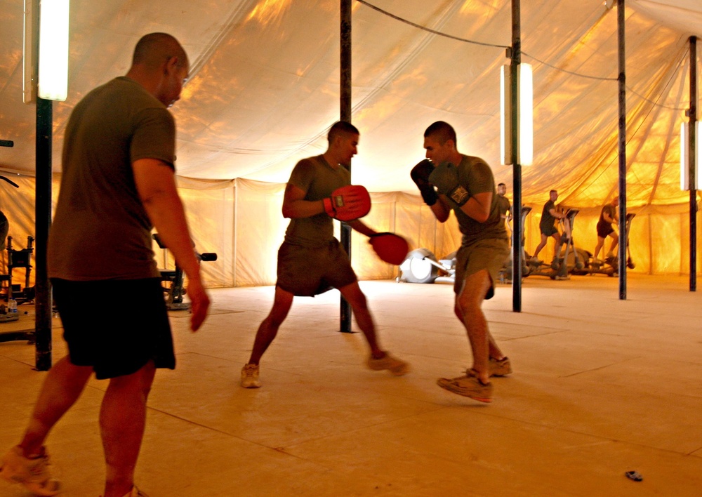 Boxing sailor mixes it up with Marines, colleagues during training