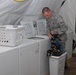 Airman washes clothes