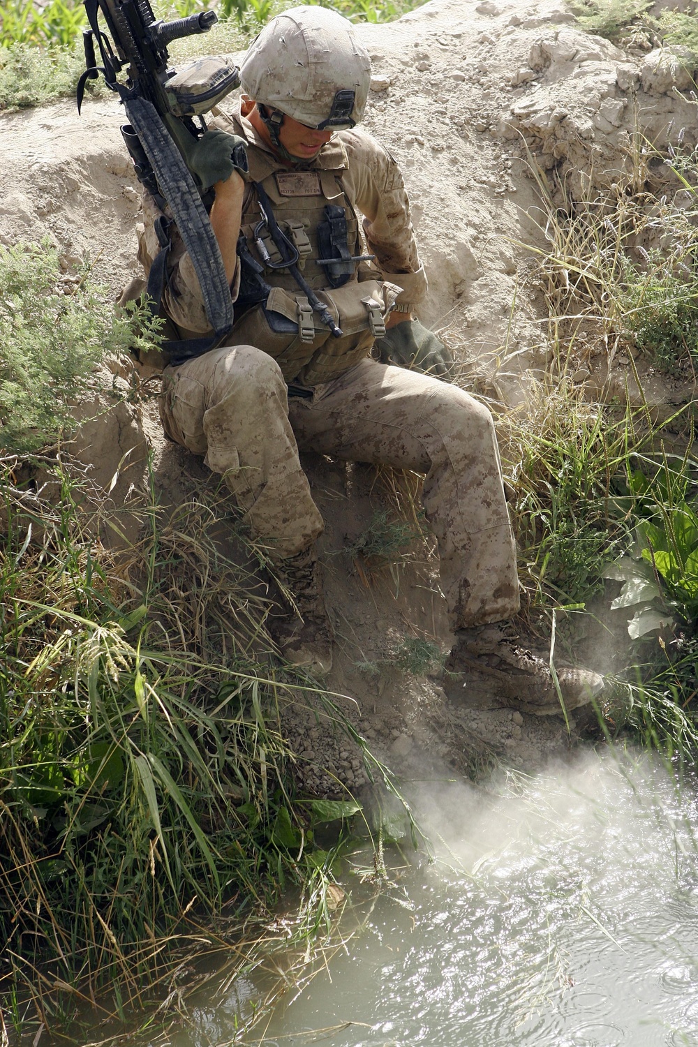 Patrolling in the Helmand River valley near Patrol Base Hasanabad
