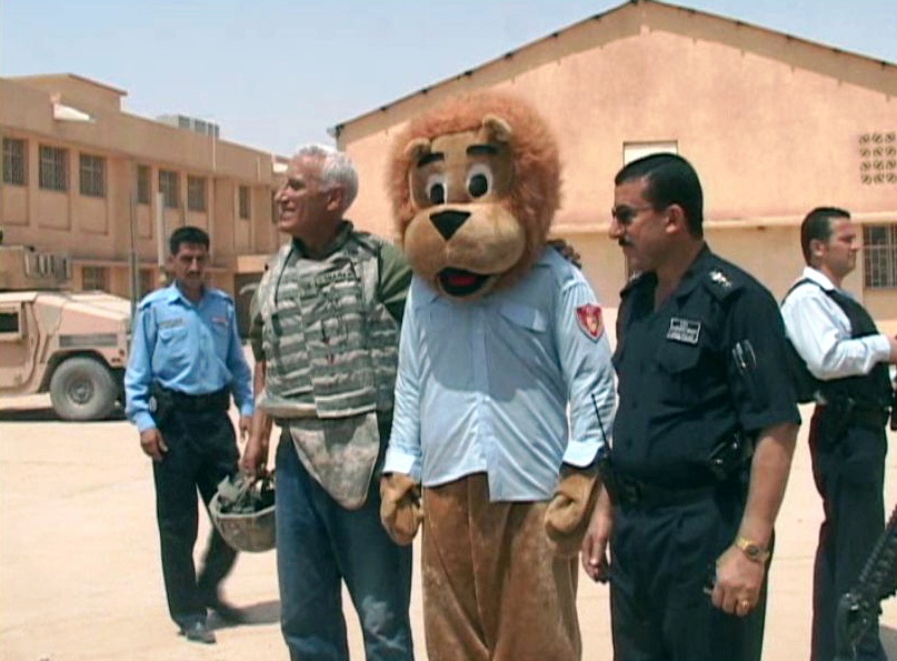 Iraqi police distribute aid and a message of hope