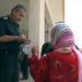 Iraqi police distribute aid and a message of hope
