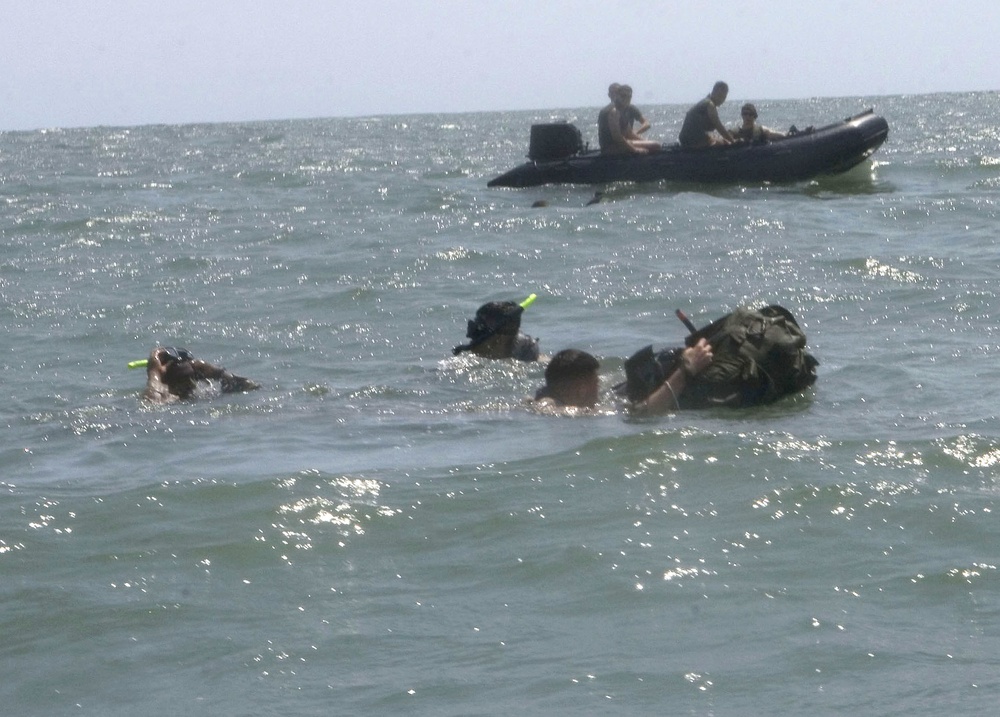 Catching the Surf; Recon Marines Helo-cast Into Open Water, Swim to Shore