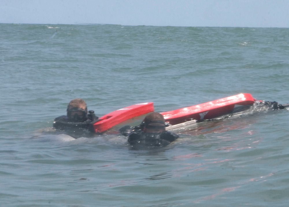 Catching the Surf; Recon Marines Helo-cast Into Open Water, Swim to Shore