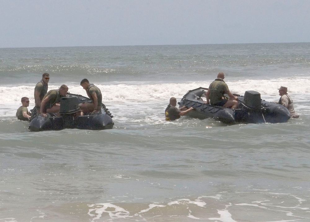 Catching the Surf; Recon Marines Helo-cast Into Open Water, Swim to Shore