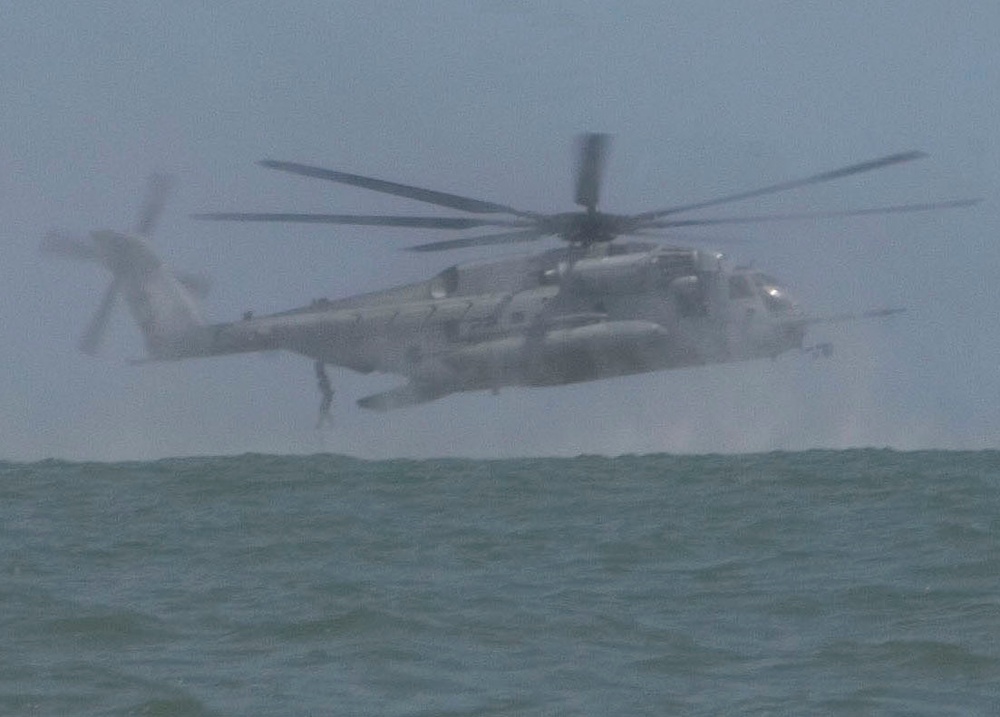 Catching the Surf; Recon Marines Helo-cast Into Open Water, Swim to Shore