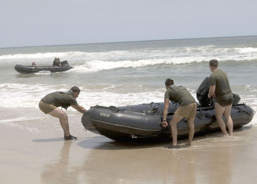 Catching the Surf; Recon Marines Helo-cast Into Open Water, Swim to Shore