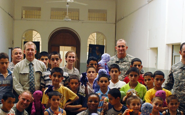 Soldiers Deliver Nainoa Dolls to Orphanage