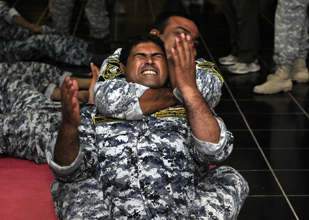 Soldiers and Iraqi federal police wrestle for success