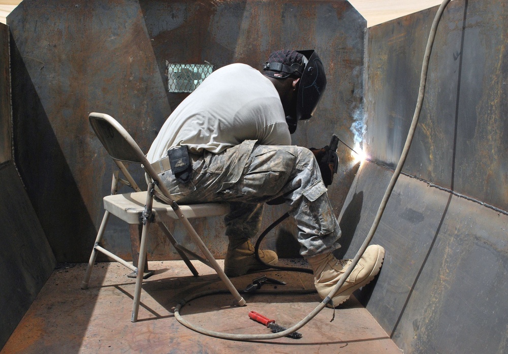 Airborne metal men armor Iraqi security forces trucks