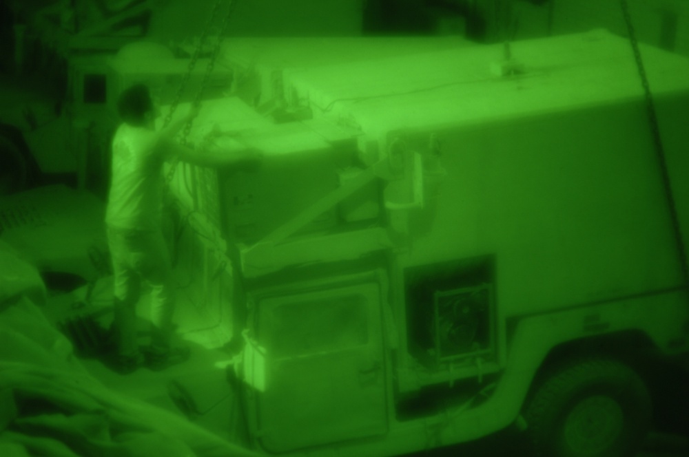 U.S. troops lift Humvee from hole