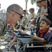 U.S. Soldiers, civilians deliver wheelchairs to Iraqi children in need.