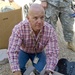 U.S. Soldiers, civilians deliver wheelchairs to Iraqi children in need.