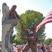 The U.S. Flag flies over a statue of Pfc. Thomas Tucker extending a helping hand to an Iraqi girl in Madras, Ore., Aug. 23. The statue was dedicated as a veteran's memorial in Friendship Park. Tucker, 25, was killed near Baghdad, Iraq, June 16, 2006. The