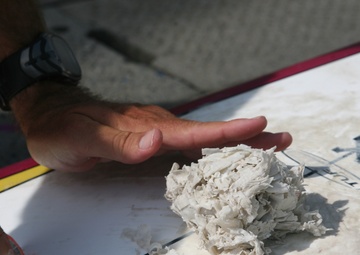 Scraping off wax