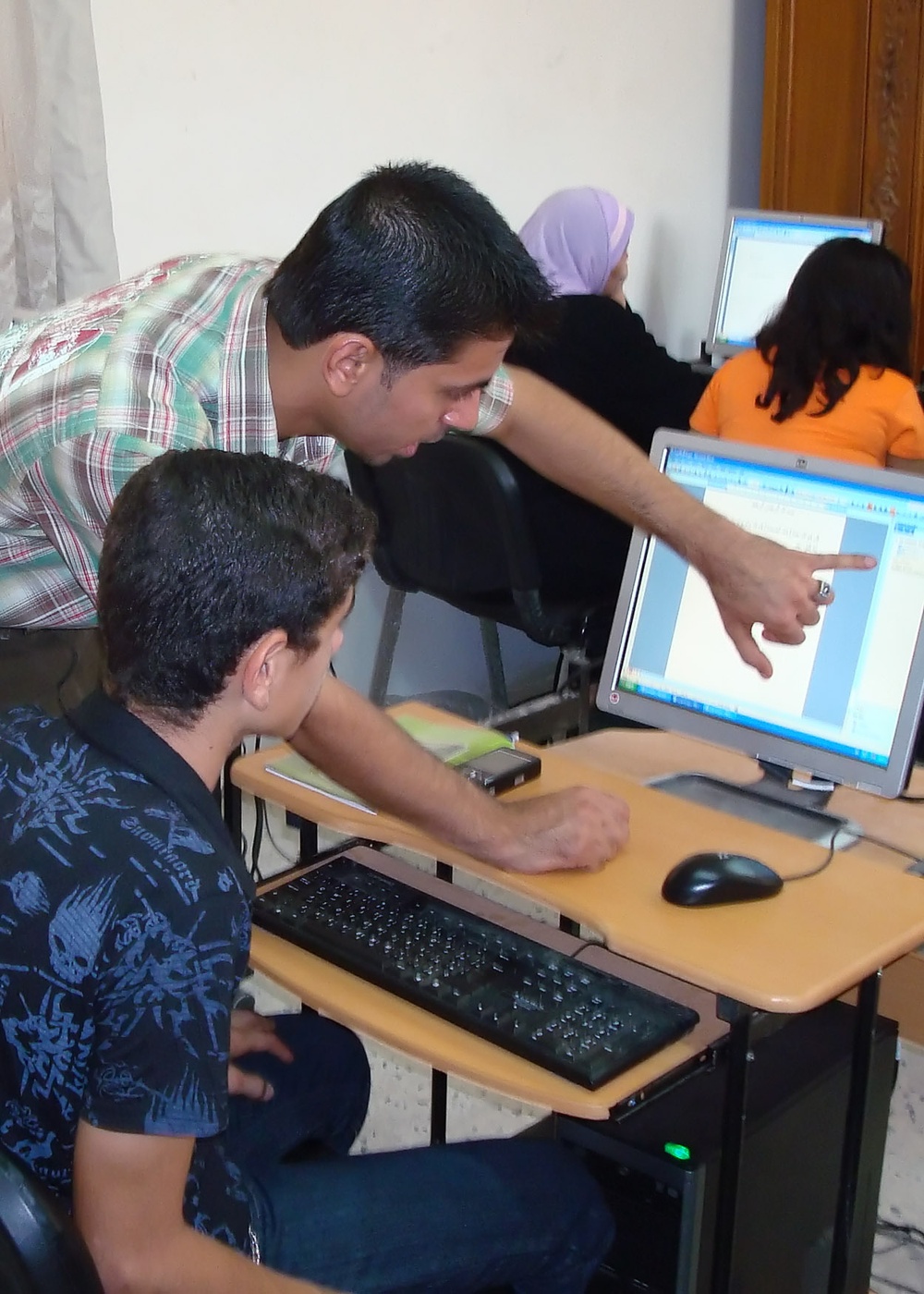 Iraqis learn computer, sewing skills