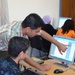 Iraqis learn computer, sewing skills