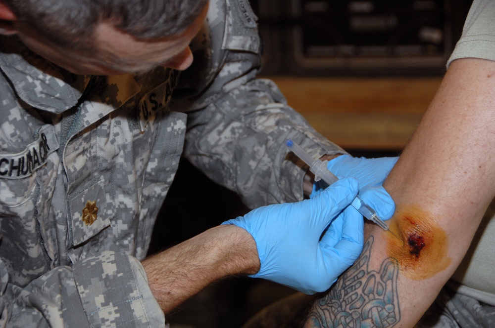 Soldier receives medical aid at Joint Security Station War Eagle