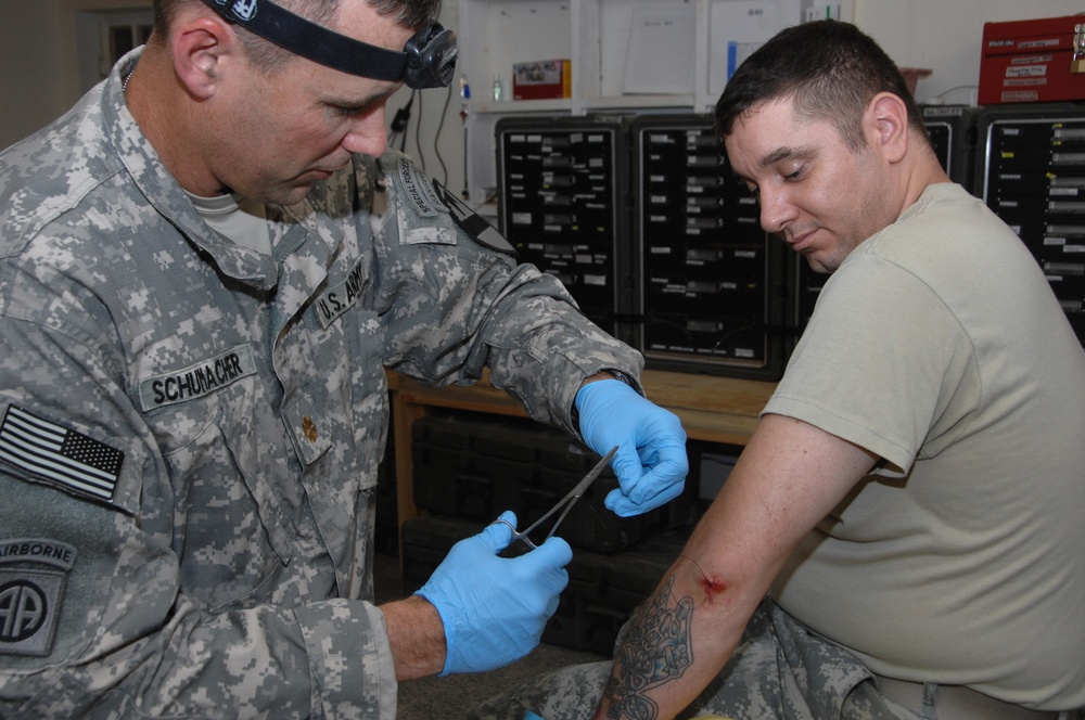 Soldier receives medical aid at Joint Security Station War Eagle