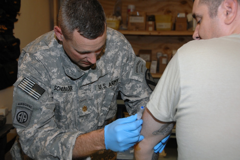Soldier receives medical aid at Joint Security Station War Eagle