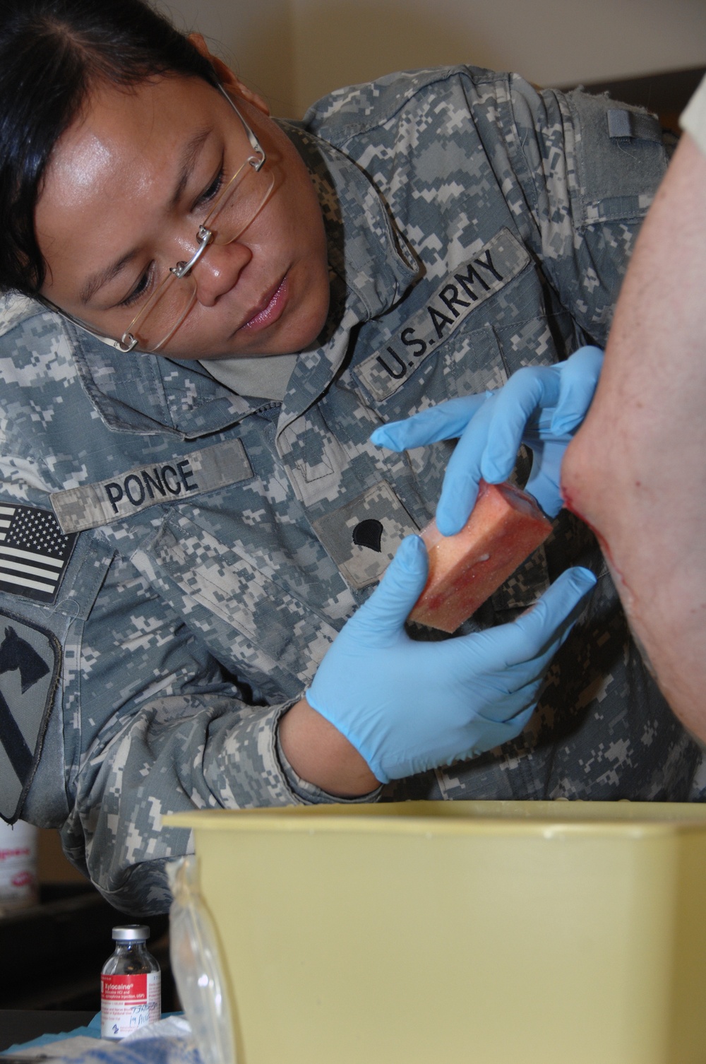 Soldier receives medical aid at Joint Security Station War Eagle