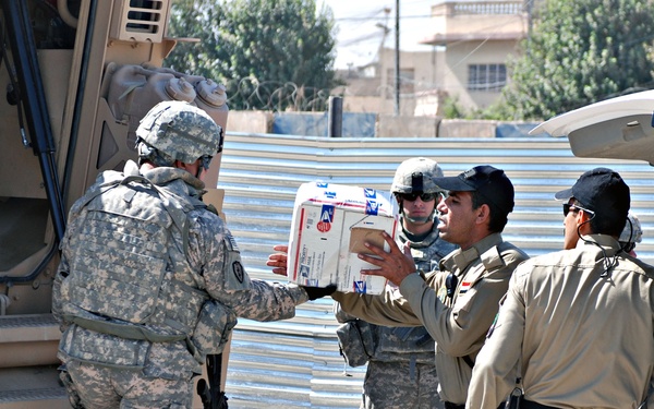 Soldiers Deliver Dog Food to IP Kennel
