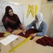 Iraqi women learn sewing