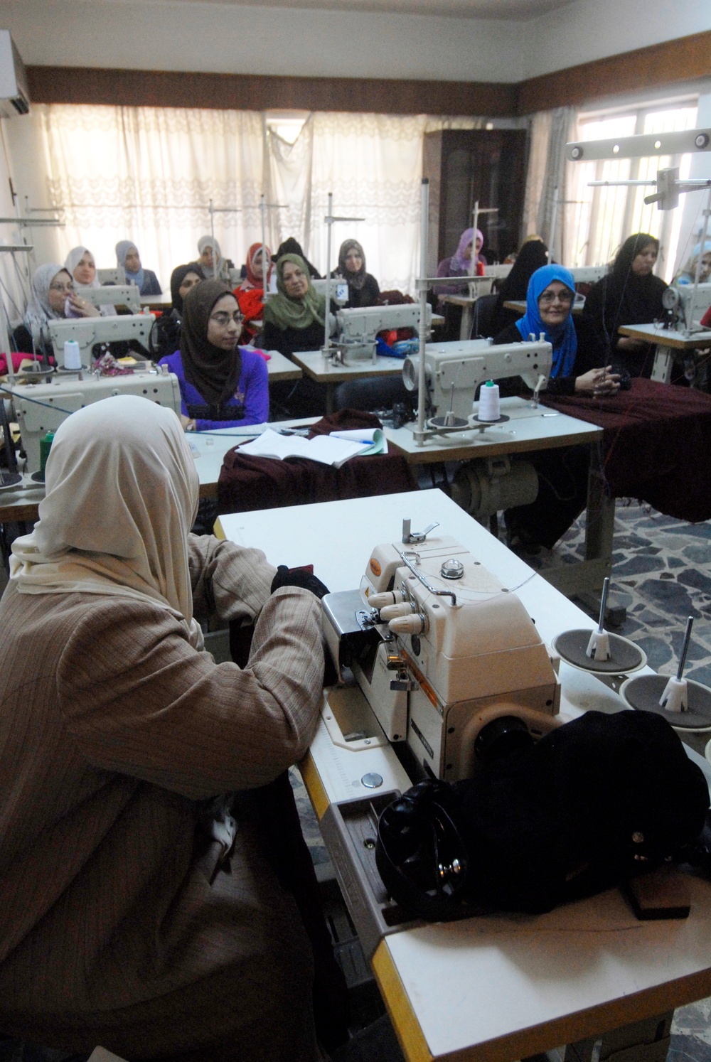 Iraqi women learn sewing