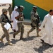 Soldiers visit Iraqi police during micro-grant survey