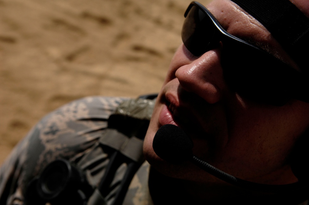 Airmen control aircraft during ground patrol