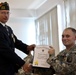 Andrew Murphy, commander, Veteran's of Foreign Wars Chapter 5172, Odenton, Md., presents U.S. Army Spc. Evan D. Marcy, 55th Signal Company (Combat Camera), with a lfetime membership during a ceremony in his honor at McGill Community Activity Center on For
