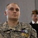 U.S. Army Spc. Evan D. Marcy, 55th Signal Company (Combat Camera), listens as Andrew Murphy, commander, Veteran's of Foreign Wars Chapter 5172, Odenton, Md., presents him with a lfetime membership during a ceremony in his honor at McGill Community Activit