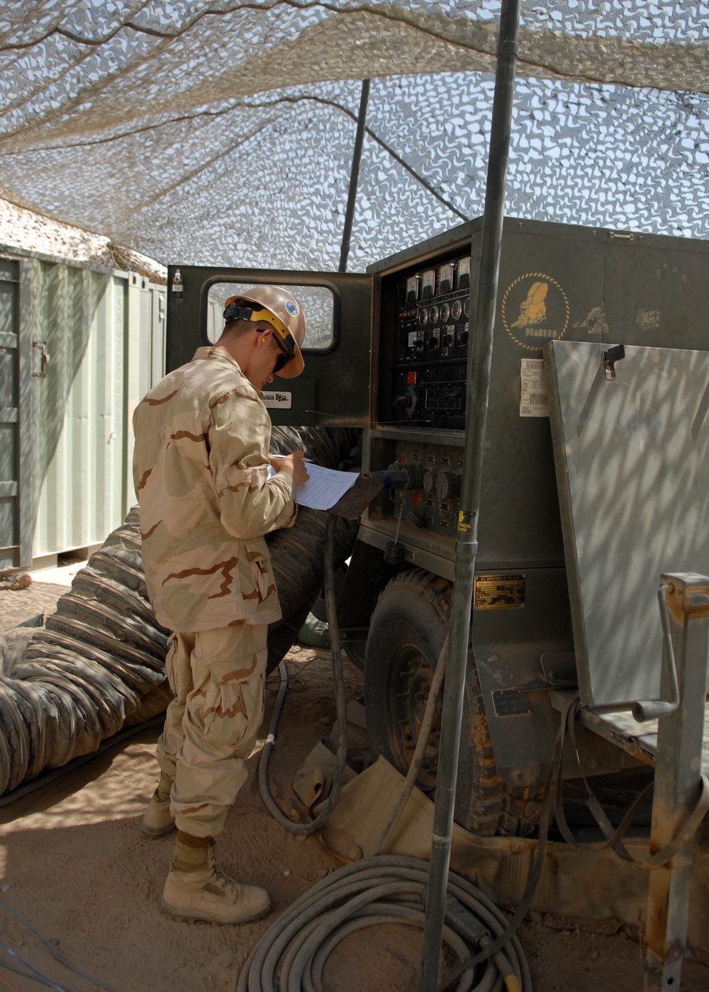 NMCB-74 Camp Maintenance Monitors Generators at Camp Natasha