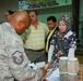 Service members work with Iraqi businesses