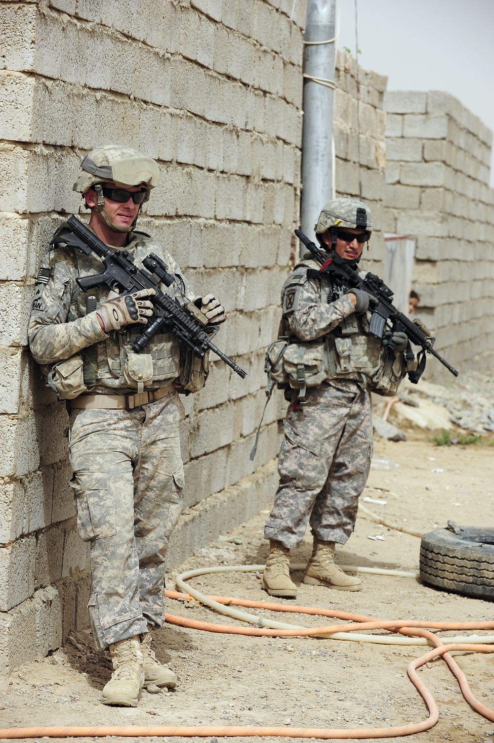Soldiers hand out packages to locals