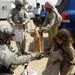 Soldiers hand out toys, check on police station project