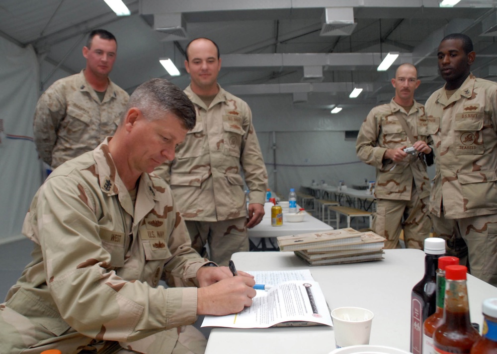 MCPON West Signs NMCB-74 Chief Select's Charge Books