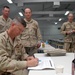 MCPON West Signs NMCB-74 Chief Select's Charge Books