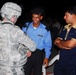 Soldiers talk with locals during mission