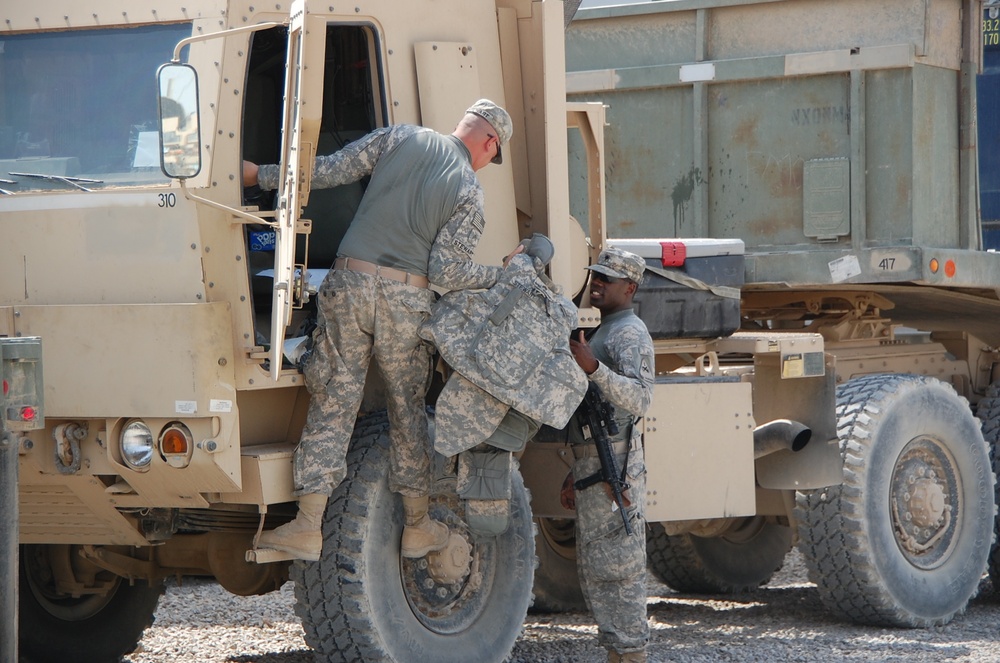 Soldiers prepare for a combat logistics convoy mission