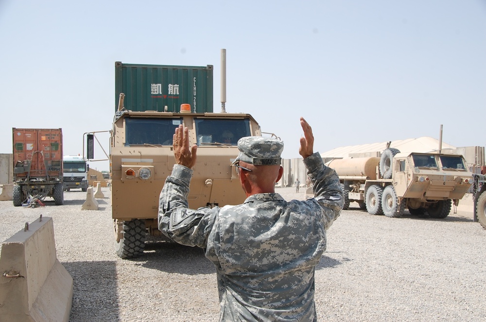 Soldiers prepare for a combat logistics convoy mission