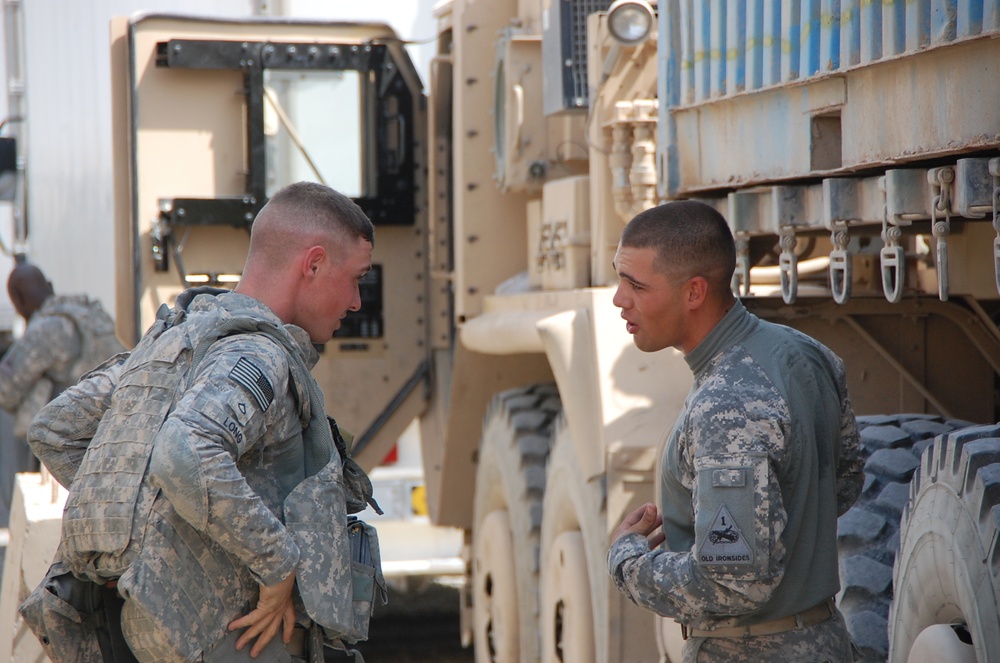Soldiers prepare for a combat logistics convoy mission