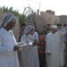 Iraqi soldiers give out food in Baghdad