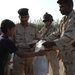Iraqi soldiers give out food in Baghdad