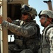 US troops repair a roadway near Iraq border