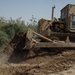 US troops repair a roadway near Iraq border