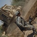 US troops repair a roadway near Iraq border