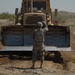 US troops repair a roadway near Iraq border