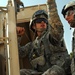 US troops repair a roadway near Iraq border