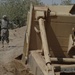 US troops repair a roadway near Iraq border